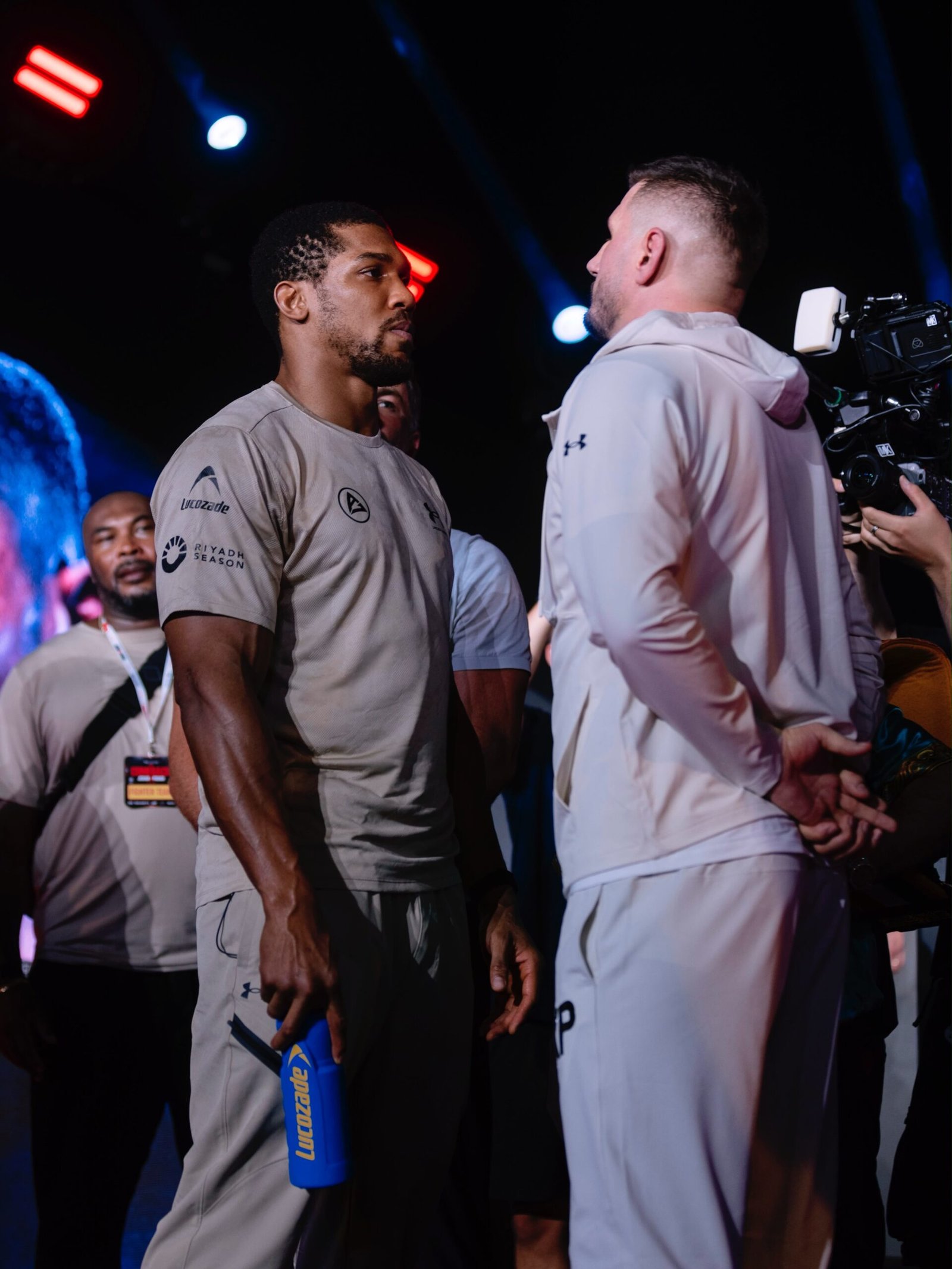 Heavyweight boxers Anthony Joshua and Kristian Prenga engaging in a tense pre-match face-off prior to their fight at the Jeddah Superdome.