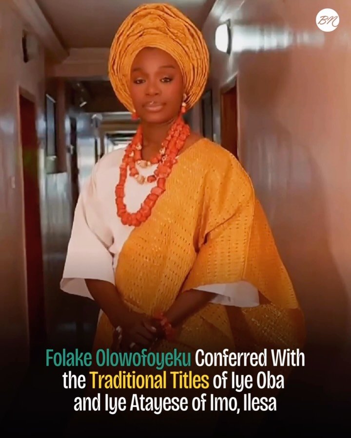 Folake Olowofoyeku wearing a white traditional outfit, gold gele, and coral beads following her chieftaincy conferment as Yeye Oba and Yeye Atayese in Ilesa, Osun State.