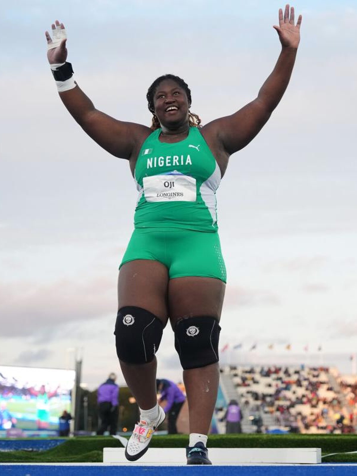 Nigerian shot putter Jessica Oji raising her arms in celebration after securing silver in the women's shot put final at the Glasgow 2026 Commonwealth Games.