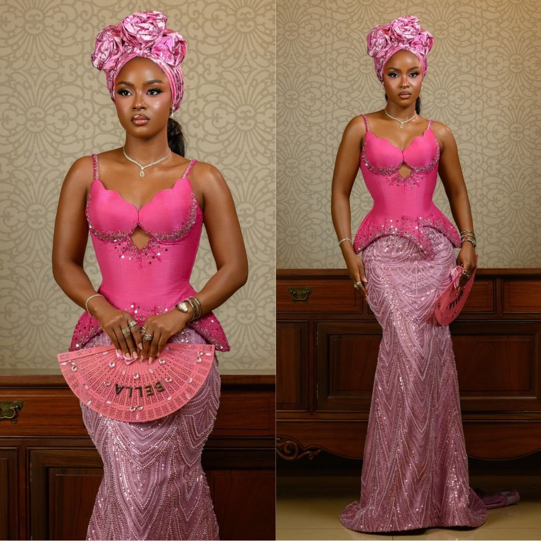 Bella Okagbue wearing a hot-pink basque corset gown with a blush-pink sequined mermaid skirt and rose-pink Gele for Akin Faminu and Kiky Festus traditional wedding in Lagos.