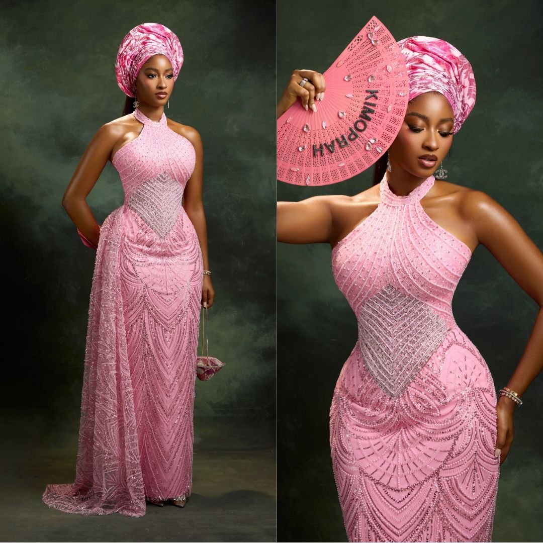 Kim Opara wearing a pink halter-neck gown with chevron sequin embellishments and a matching Gele for Akin Faminu traditional wedding.