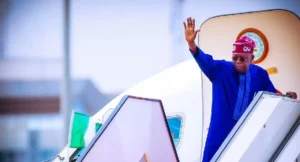 President-Bola-Tinubu-waving-on-an-airplane