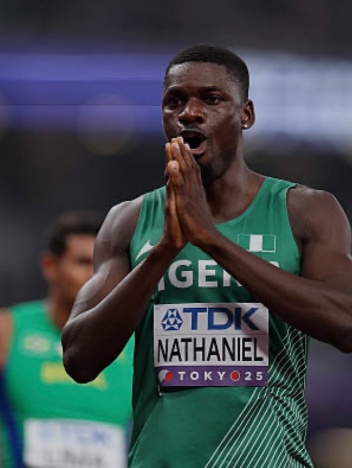 Ezekiel Nathaniel wearing green Team Nigeria jersey with TDK race bib reading NATHANIEL Tokyo 25.
