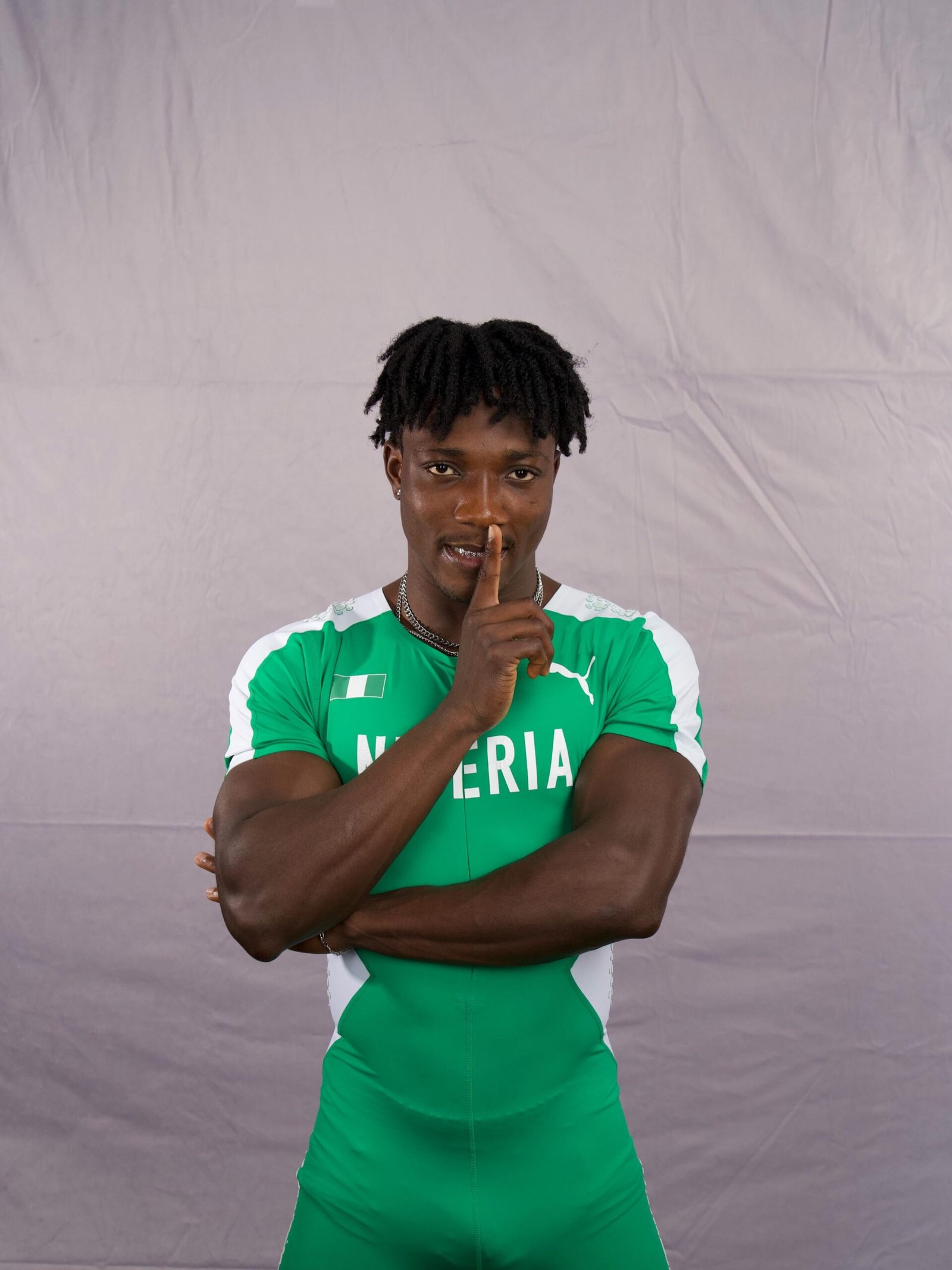 Kanyinsola Ajayi in green and white Nigeria national track and field kit.