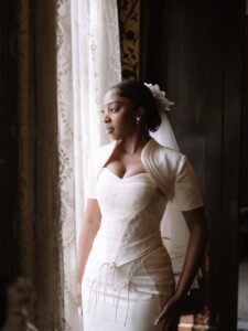 LAX leaning on a vintage silver Rolls Royce while Ella poses on the hood in her wedding dress in Malta.
