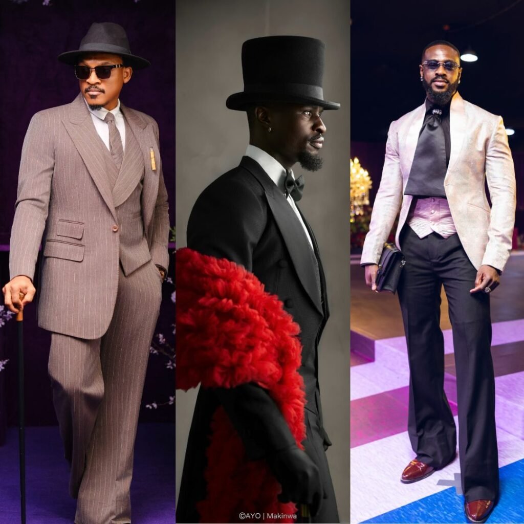 Shawn Faqua in a pinstripe suit, Larry Hector in a tailcoat with red boa, and Yemi Cregx in a blush jacquard jacket at BellaNaija red carpet.